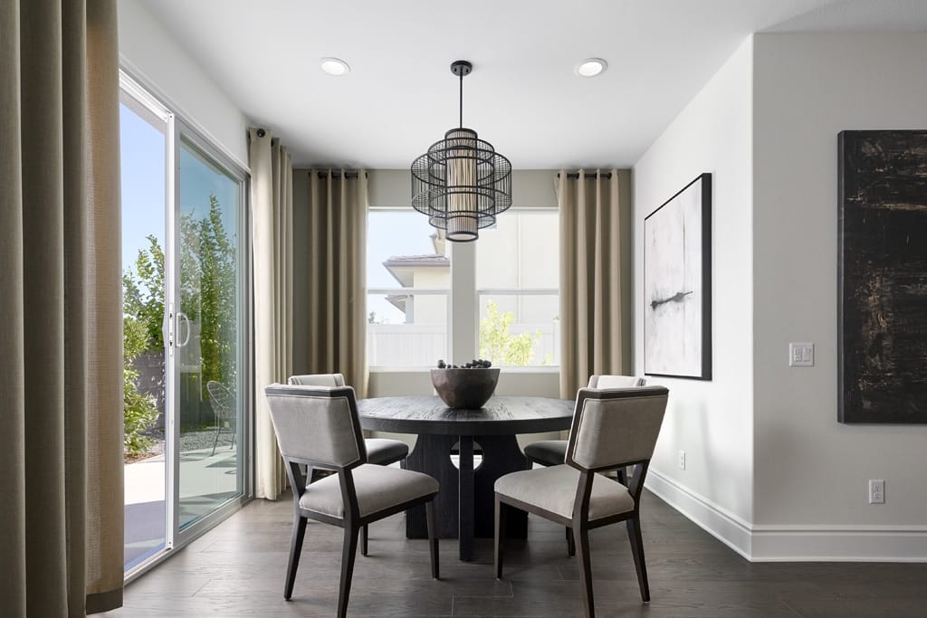Separate dining area carved out next to a powder room, offering access to the outdoors