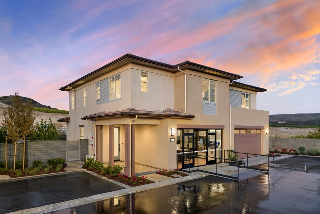 Prairie style elevation duplex with tan stucco, hipped rooflines, and earth-toned accents